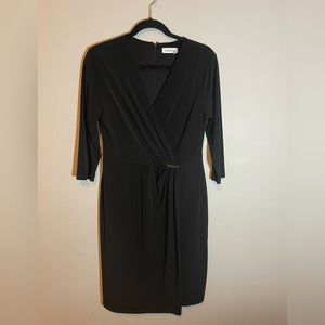 Calvin Klein black bodycon dress with 3/4 sleeves. Size 12.